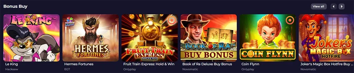 Bonus Buy slot games section featuring Le King, Hermes Fortunes, Fruit Train Express: Hold & Win, Book of Ra Deluxe Buy Bonus, Coin Flynn, and Joker’s Magic Box Hotfire, with a “View all” button on a dark casino interface.